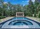 Relaxing pool with spa and a poolside gazebo in a lush, private backyard setting at 3625 Tuxedo Nw Rd, Atlanta, GA 30305