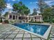 Stunning backyard features a large pool with a spa and geometric stone patio at 3625 Tuxedo Nw Rd, Atlanta, GA 30305