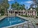 Gorgeous backyard with a swimming pool, spa, and beautifully landscaped patio areas at 3625 Tuxedo Nw Rd, Atlanta, GA 30305