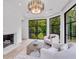 Sitting room features a fireplace, decorative lighting, and ample natural light at 3625 Tuxedo Nw Rd, Atlanta, GA 30305