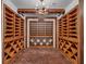 Custom wine cellar featuring extensive wood racking and brick flooring at 3625 Tuxedo Nw Rd, Atlanta, GA 30305