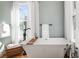 Modern bathroom with a freestanding tub, a window view, and stylish fixtures at 11 Pine St, Covington, GA 30014