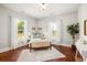 Bright bedroom with hardwood floors, two windows, white walls, and decor at 11 Pine St, Covington, GA 30014