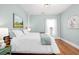 Cozy bedroom with hardwood floors, neutral paint, and natural light at 11 Pine St, Covington, GA 30014