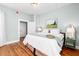 Bright bedroom with hardwood floors, neutral paint, and natural light at 11 Pine St, Covington, GA 30014