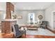 Stylish living room with hardwood floors, brick fireplace, white shiplap walls, and comfortable seating arrangement at 11 Pine St, Covington, GA 30014