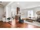 Bright living room with hardwood floors, white shiplap walls, a brick fireplace, and stylish furnishings for comfortable living at 11 Pine St, Covington, GA 30014