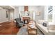 Spacious living room with hardwood floors, white shiplap walls, brick fireplace, and elegant furnishings for comfortable living at 11 Pine St, Covington, GA 30014