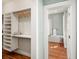 Spacious walk-in closet with custom shelving and ample storage space at 11 Pine St, Covington, GA 30014