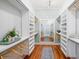 Large walk-in closet with shelves and hanging rods, plus a full-length mirror at 11 Pine St, Covington, GA 30014