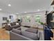 Inviting living room featuring neutral colors, comfortable seating, and ample natural light for a cozy atmosphere at 11415 Hutcheson Ferry Rd, Chattahoochee Hills, GA 30268