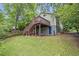 Backyard view featuring deck, lush lawn and landscaping at 1265 Woodland Se Ave, Atlanta, GA 30316