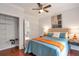 Primary bedroom with a large bed, ensuite bathroom, and walk-in closet at 1265 Woodland Se Ave, Atlanta, GA 30316