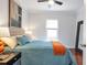 Bedroom featuring a comfortable bed, lamps, and a ceiling fan at 1265 Woodland Se Ave, Atlanta, GA 30316
