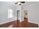 An airy bedroom featuring hardwood floors, closet and view of adjoining space at 1265 Woodland Se Ave, Atlanta, GA 30316