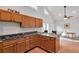 This bright kitchen is open to the dining area and has lots of natural light and wood cabinets at 1265 Woodland Se Ave, Atlanta, GA 30316