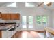 Bright open-concept kitchen and dining area with natural light and a view of the deck at 1265 Woodland Se Ave, Atlanta, GA 30316