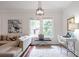 Bright living area featuring a comfortable sectional sofa, hardwood floors, and modern decor at 1265 Woodland Se Ave, Atlanta, GA 30316