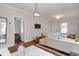 Open living room with hardwood floors, sectional sofa, and ample natural light at 1265 Woodland Se Ave, Atlanta, GA 30316
