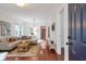 Bright living room featuring a modern sofa, hardwood floors, and a neutral color palette at 1265 Woodland Se Ave, Atlanta, GA 30316