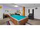 Finished basement with a pool table, drum set, keyboard, and entertainment area for leisure and activities at 410 Lima Ct, Woodstock, GA 30188