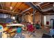 Unfinished basement, providing ample space with exposed wood ceiling and potential for future expansion at 410 Lima Ct, Woodstock, GA 30188