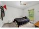 Bedroom with a window, a ceiling fan, and carpeted floors at 410 Lima Ct, Woodstock, GA 30188