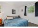 Cozy bedroom with a comfortable bed, window with natural light, and carpeted flooring at 410 Lima Ct, Woodstock, GA 30188