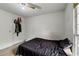 Bedroom with a window, a ceiling fan, and carpeted floors at 410 Lima Ct, Woodstock, GA 30188