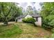 Well-maintained home surrounded by lush greenery, featuring a two-car garage at 410 Lima Ct, Woodstock, GA 30188
