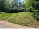 Inviting single-story home with a well-maintained front yard and mature landscaping at 410 Lima Ct, Woodstock, GA 30188