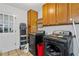 Functional laundry room with washer, dryer, ample cabinet space, and an exterior door for convenience at 410 Lima Ct, Woodstock, GA 30188