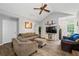 Inviting living room with a ceiling fan, hardwood floors, and recessed lighting at 410 Lima Ct, Woodstock, GA 30188