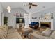 Comfortable living room featuring a fireplace, hardwood floors, and neutral colors at 410 Lima Ct, Woodstock, GA 30188