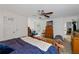 Comfortable main bedroom with a ceiling fan, a comfortable bed, and access to outdoor seating at 410 Lima Ct, Woodstock, GA 30188