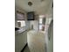 Functional kitchen design with tile floors, cabinets, and access to the living room at 4622 Dogwood Rd, Pine Lake, GA 30072