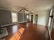 Living room features original wood floors, ample windows, and freshly painted walls at 4622 Dogwood Rd, Pine Lake, GA 30072