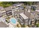 Aerial view of a luxury townhome community with a central pool and manicured landscaping at 100 Sheridan Dr, Atlanta, GA 30305