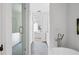 Bathroom featuring soaking tub, shower with glass door, and access to bedroom at 100 Sheridan Dr, Atlanta, GA 30305