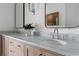 Bathroom featuring double vanity with marble countertop, modern fixtures, and wood cabinets at 100 Sheridan Dr, Atlanta, GA 30305