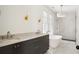 Bright bathroom featuring double vanity, soaking tub and glass enclosed shower with modern fixtures at 100 Sheridan Dr, Atlanta, GA 30305