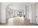 Bright and airy living room featuring hardwood floors, a fireplace, and large windows at 100 Sheridan Dr, Atlanta, GA 30305