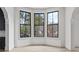 Bay window view in living room with sleek hardwood floors, creating a cozy and bright atmosphere at 100 Sheridan Dr, Atlanta, GA 30305