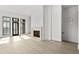 Spacious living room features modern fireplace, and large windows offering plenty of natural light at 100 Sheridan Dr, Atlanta, GA 30305