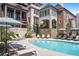 Upscale neighborhood pool surrounded by brick townhomes and a manicured landscape at 100 Sheridan Dr, Atlanta, GA 30305