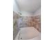 Bathtub with shower and patterned tile surround at 180 Old Airport Rd, Carrollton, GA 30116