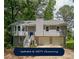 Charming two-story home featuring a two-car garage and well-maintained landscaping at 180 Old Airport Rd, Carrollton, GA 30116