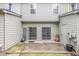 Backyard patio features sliding glass doors and access to the yard at 3364 Thornbridge Dr # 0, Powder Springs, GA 30127