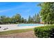 The community pool features manicured lawn surrounded by steel fencing and green bushes at 3364 Thornbridge Dr # 0, Powder Springs, GA 30127