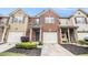 Well-maintained townhome with brick and siding, showcasing a one-car garage and landscaped front yard at 3364 Thornbridge Dr # 0, Powder Springs, GA 30127
